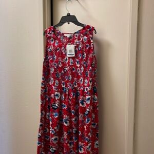 Emily Daniels, red and blue floral dress.